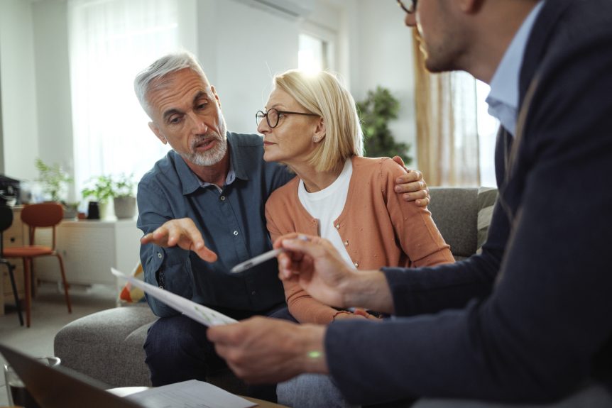 Couple reviewing their pension options before choosing an annuity