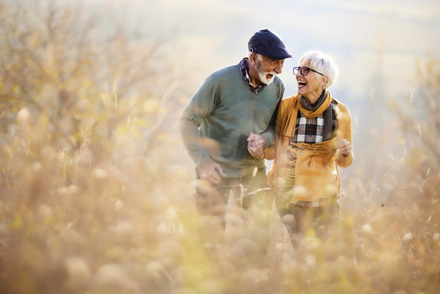 Retired couple enjoying time outdoors after securing their retirement income
